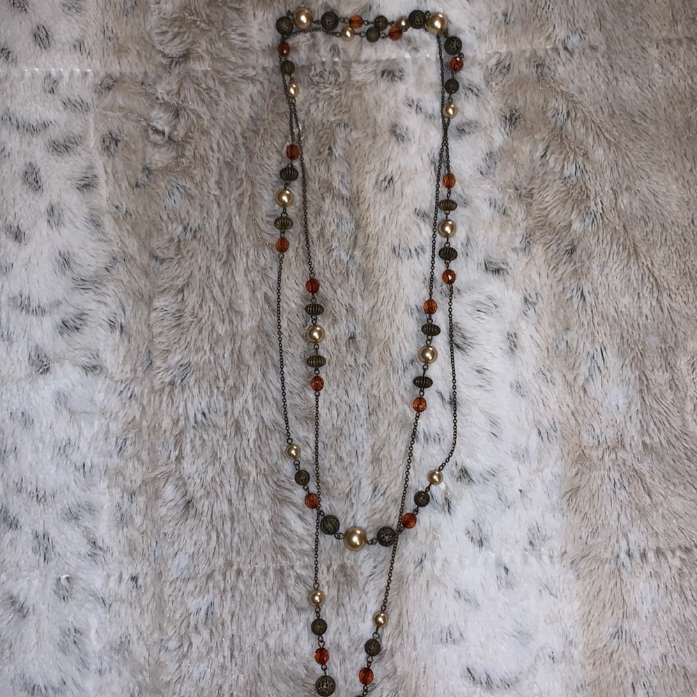 Bronze, pearl, and gem long necklace.